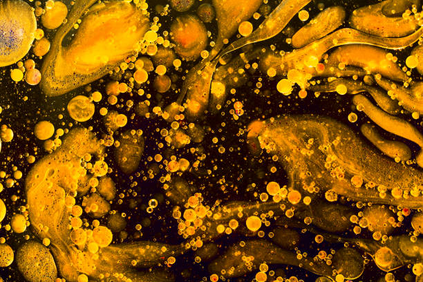istock Yellow liquid water abstract background. Macro photography 1161451181