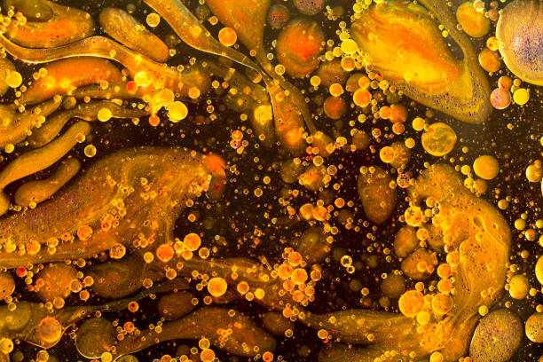 istock Yellow liquid water abstract background. Macro photography 1161451182