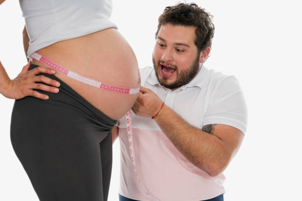 istock Father playing with his wife's pregnancy belly 1161454628