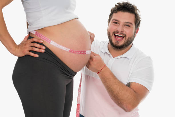 istock Father playing with his wife's pregnancy belly 1161454686