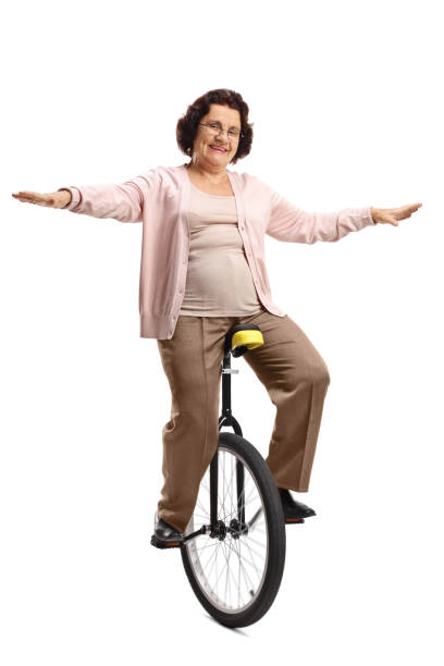 istock Energetic elderly woman riding a mono-cycle 1161459004