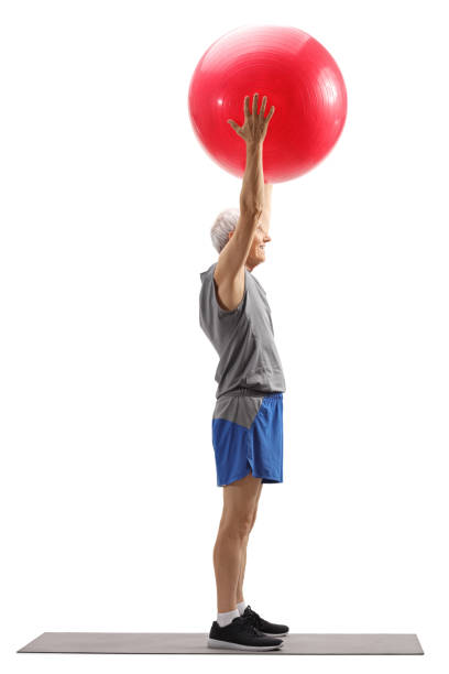 istock Senior man exercising pilates with a ball 1161459741