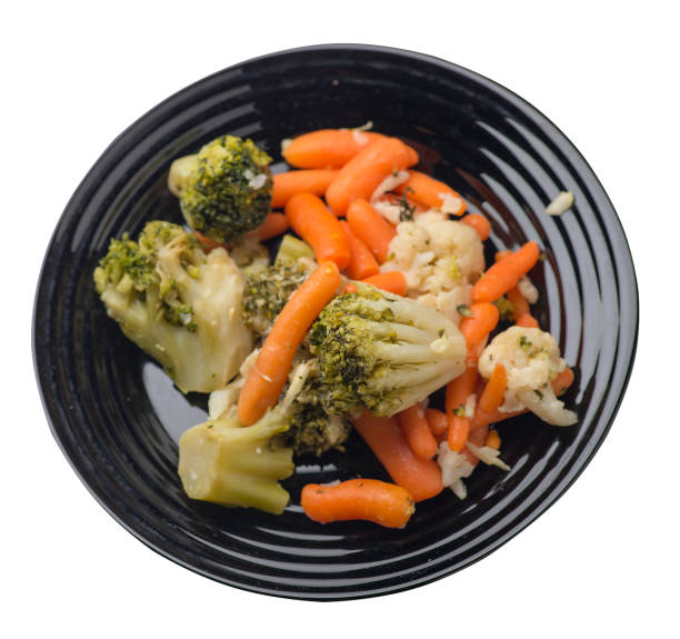 istock provencal vegetables on a plate.grilled vegetables on a plate isolated on white background.broccoli and carrots on a plate top view.healthy  food 1161460520