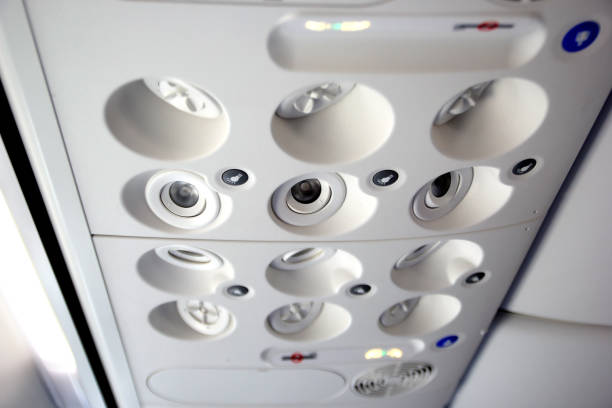 istock air grille diffuser and lamp on ceiling  in the airplane 1161460665