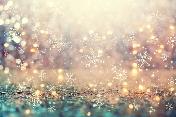 schneeflocken auf einem abstrakten glänzenden lichthintergrund - glitzernd fotos stock-fotos und bilder