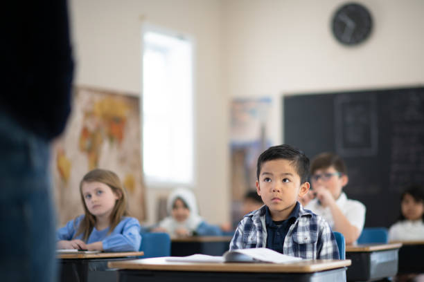 istock Students Listening to Their Teacher Speak 1161475949