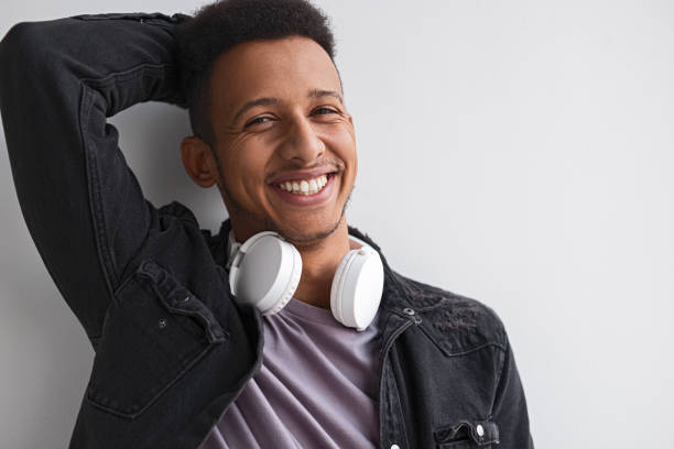 istock Smiling black male with headphones 1161476415