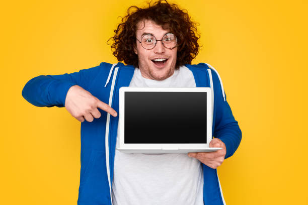 istock Funny nerd showing blank laptop 1161476599