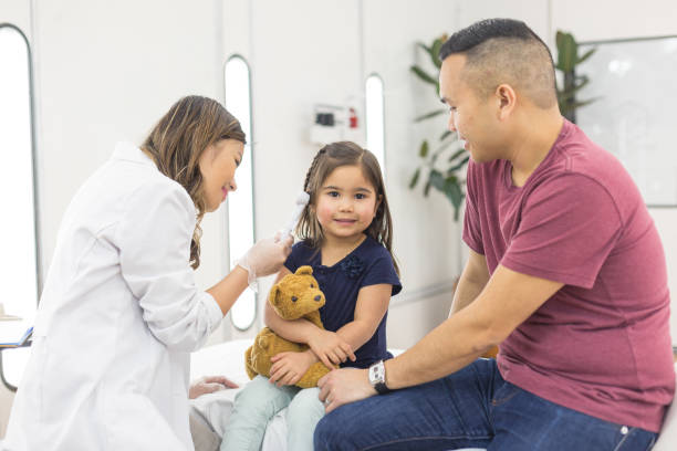 istock Young ethnic girl at the doctor's office getting a checkup 1161477002