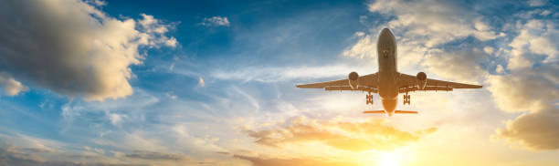 Airplane in the sky at sunrise