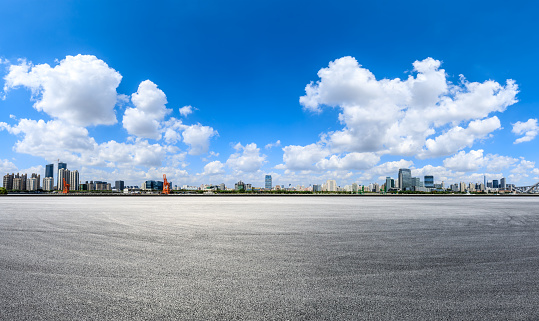 Empty asphalt road and modern city skyline in Shanghai