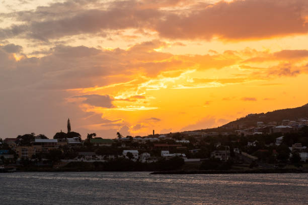 view of golden island sunset over Saint Kitts and Nevis from the sea
