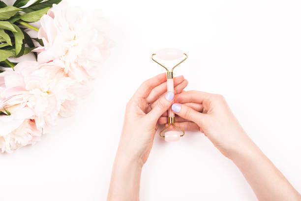 istock Gua sha massage jade roller in woman hands. 1161490051