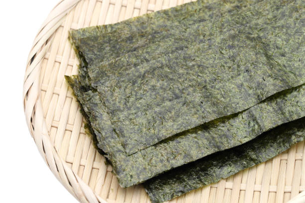 Japanese food, Nori dry seaweed sheets Japanese food, Nori dry seaweed sheets on plate nori stock pictures, royalty-free photos & images