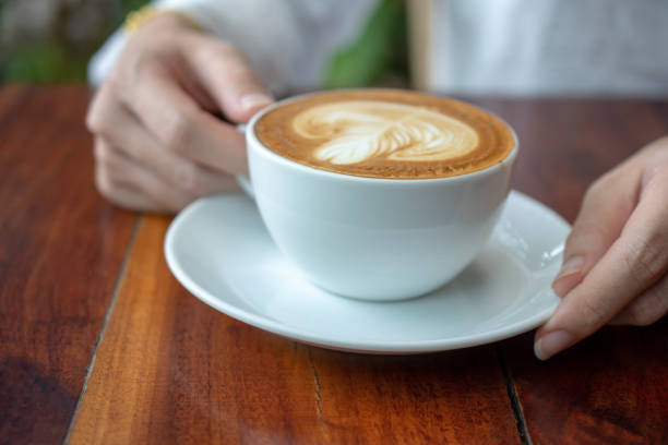 istock Coffee latte on wood table in coffee shop 1161494546