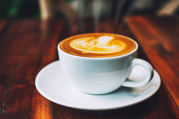 istock Coffee latte on wood table in coffee shop 1161494558