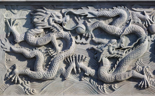 istock A white wall with dragon stone sculpture background 1161495263