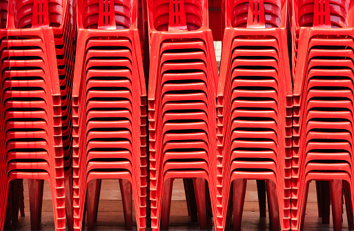 Render Of Stacked Red color Chairs background