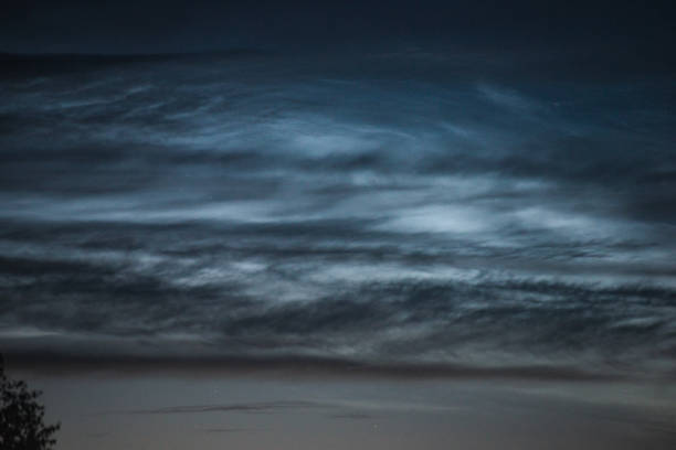 istock Noctilucent clouds close up on a summer night. Glowing clouds in the night sky. 1161501611