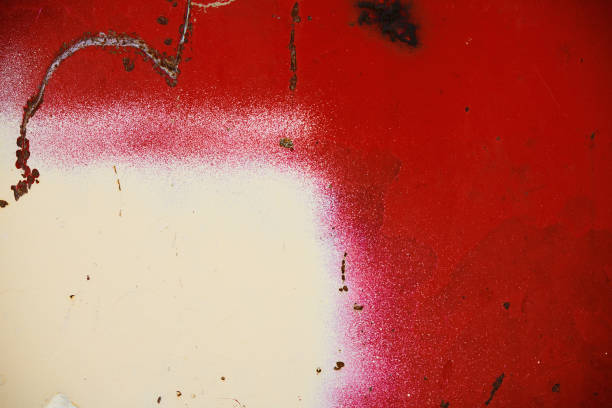 Rusty red metal background with white spray paint and scratches