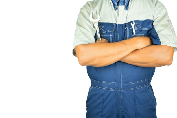 istock Professional auto technician holding wrench his inspecting and maintenance auto care. Isolated on white background with copy space. 1161505583