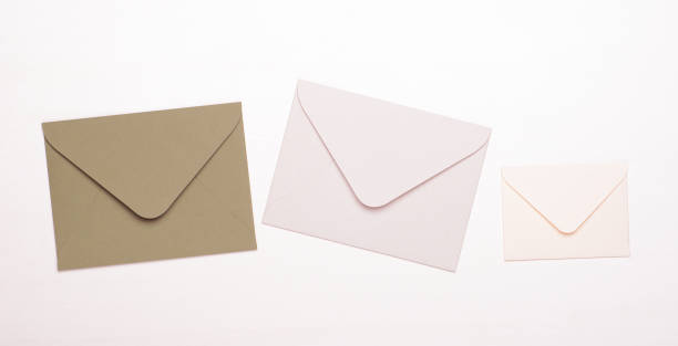 istock Beige and white envelopes on a white background. Concept of letters, messages, correspondence, copy space, top view, flat lay. 1161509941
