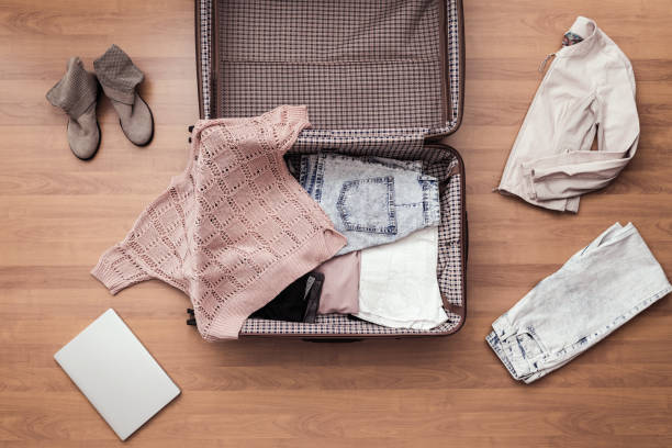 istock Top view of packed a luggage or suitcase for journey. 1161511364