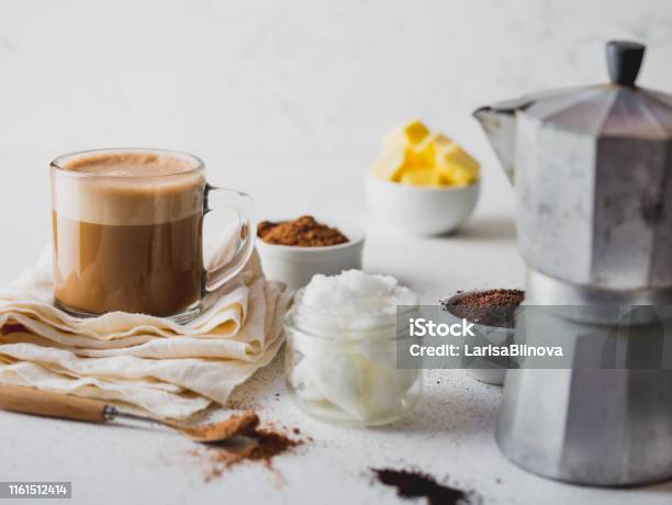 Ketogenic Keto Diet Drink Coffe And Cacao Blended With Coconut Oil Cup Of Bulletproof Coffe With Cacao And Ingredients On White Background Stock Photo - Download Image Now