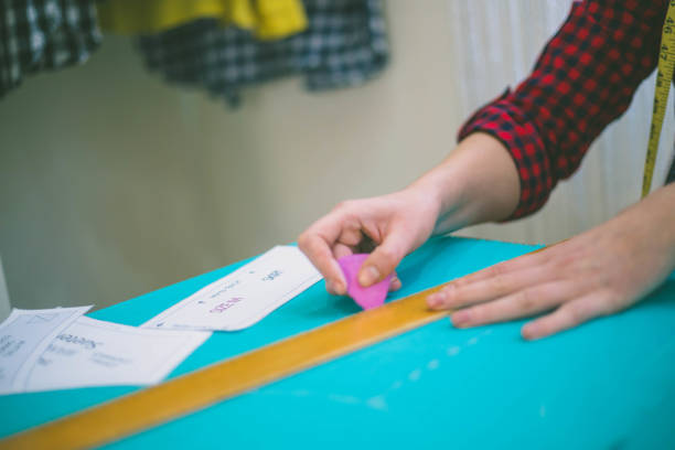 istock Seamstress woman preparing material 1161514482