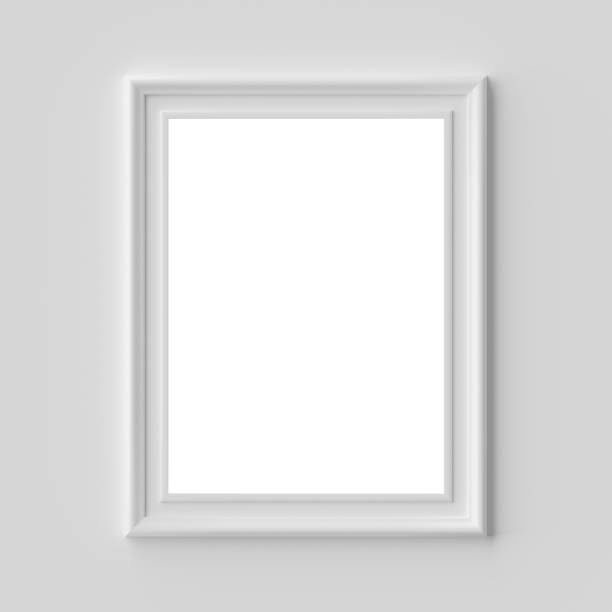 istock White picture or photo frame on white wall vertical with copy-space 1161515975