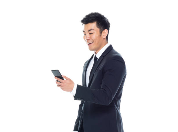 istock Handsome Chinese businessman -holding smart phone 1161517005