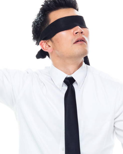 istock Handsome Asian Businessman - is wearing a blindfold 1161517095