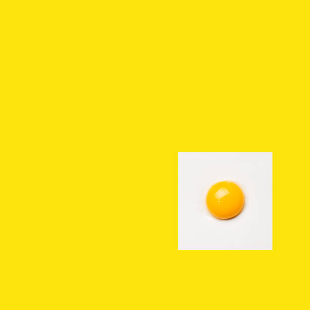 istock Square egg isolon yellow background. Minimalistic design, colorful background 1161517150