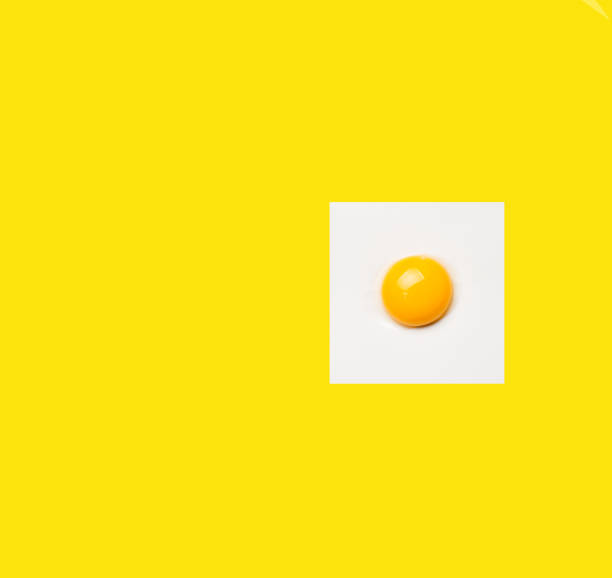 istock Square egg on yellow background. Minimalistic design, colorful background 1161517175