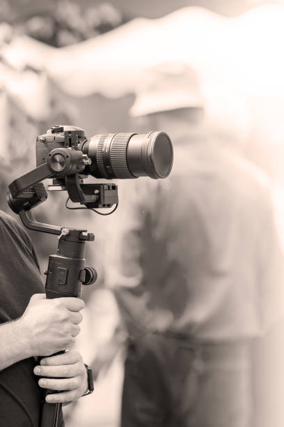 istock Video shooting with a camera with a tripod with a black stabilizer 1161519970