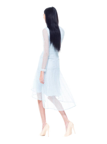 istock Beautiful female wearing light blue dress - walking 1161520234
