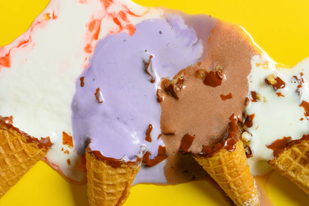 top view multiple flavor ice cream cones melted close up on yellow background