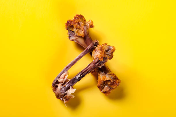 istock top view bones of deep fried chicken drumstick and wing on yellow background 1161521419