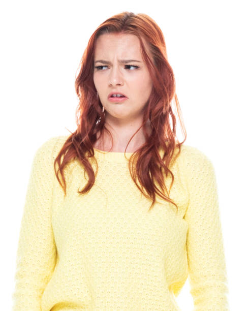 istock Cute young female wearing a yellow sweater and light blue jeans 1161521977
