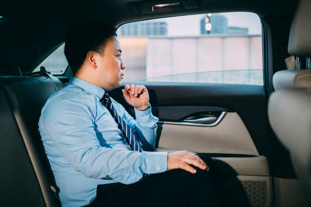 istock Asian businessman sitting in the car meditating. 1161523202