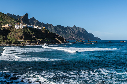 The first rays of the rising sun illuminate the rocky bays on the Northern coast of the island of Tenerife.