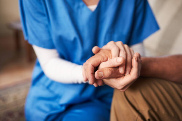 You'll never be alone again Cropped shot of a female nurse hold her senior patient's hand old hands stock pictures, royalty-free photos & images