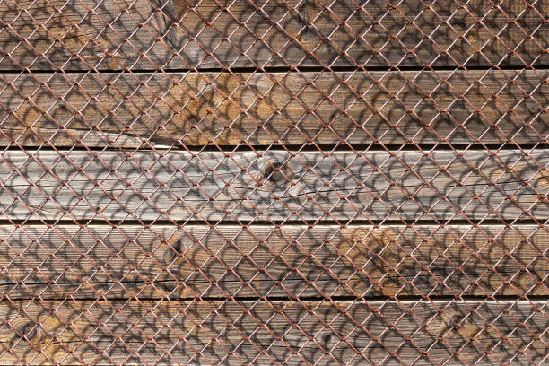 Old metal mesh over wooden wall. Perfect background for website and print banners