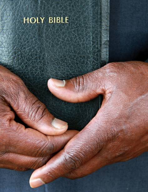 istock black man holding the Holy Bible 1161527082