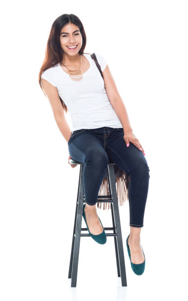 istock Good looking female sitting on a black stool and is happy 1161527954