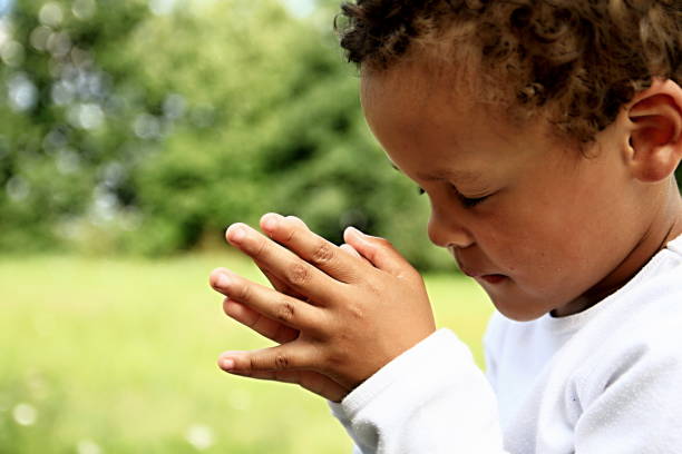 istock little boy praying to God 1161527998