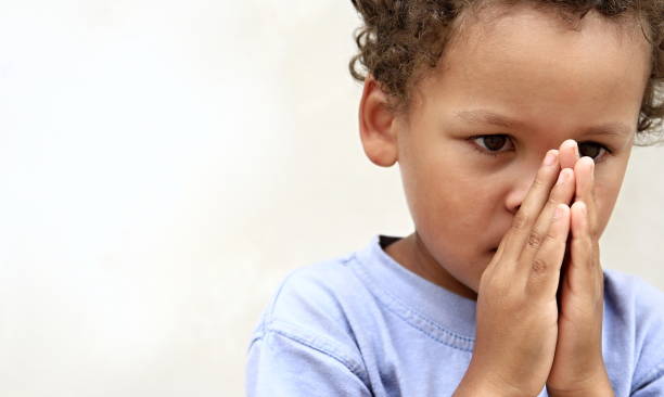 istock little boy praying to God 1161528084