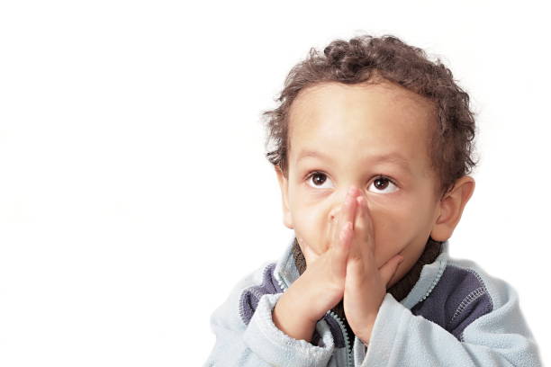 istock little boy praying to God 1161528096
