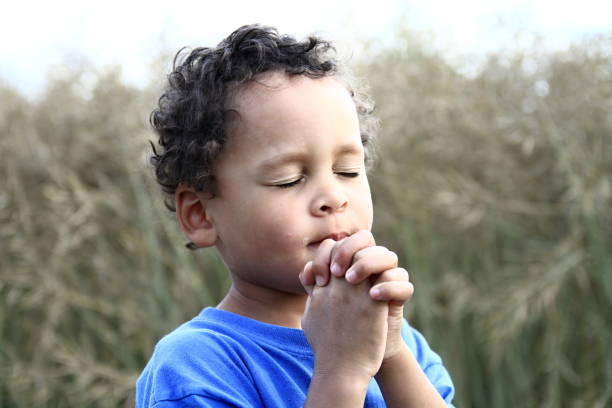 istock little boy praying to God 1161531072