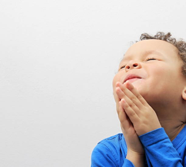 istock little boy praying to God 1161531235